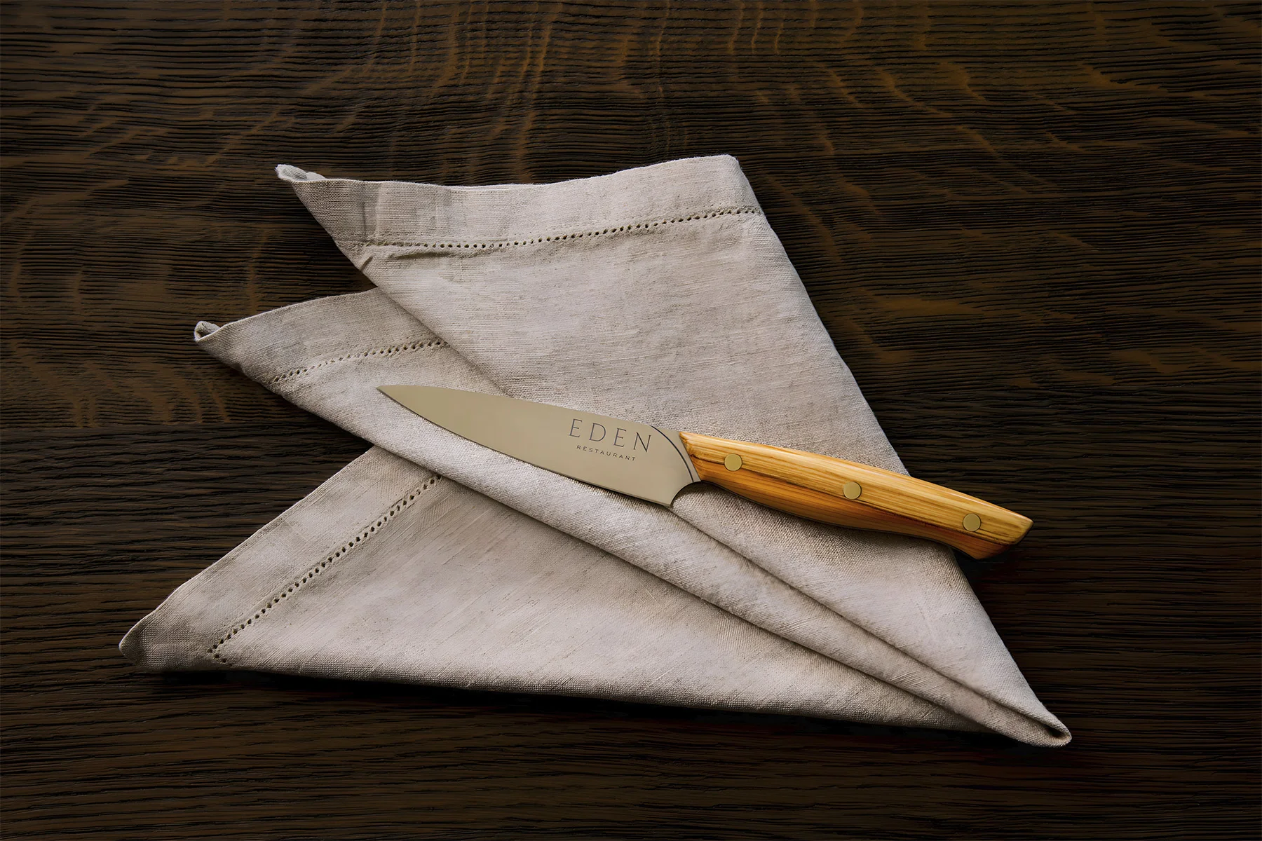 A pair of Savernake Stout Yeoman knives in contoured yew, on the table at Eden