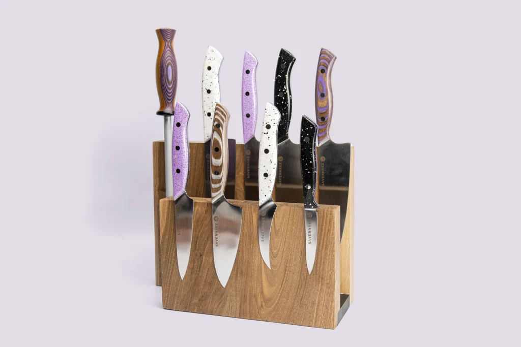Jasmine Hemsley knife collection in lavender, white and grey Durat with a walnut rack