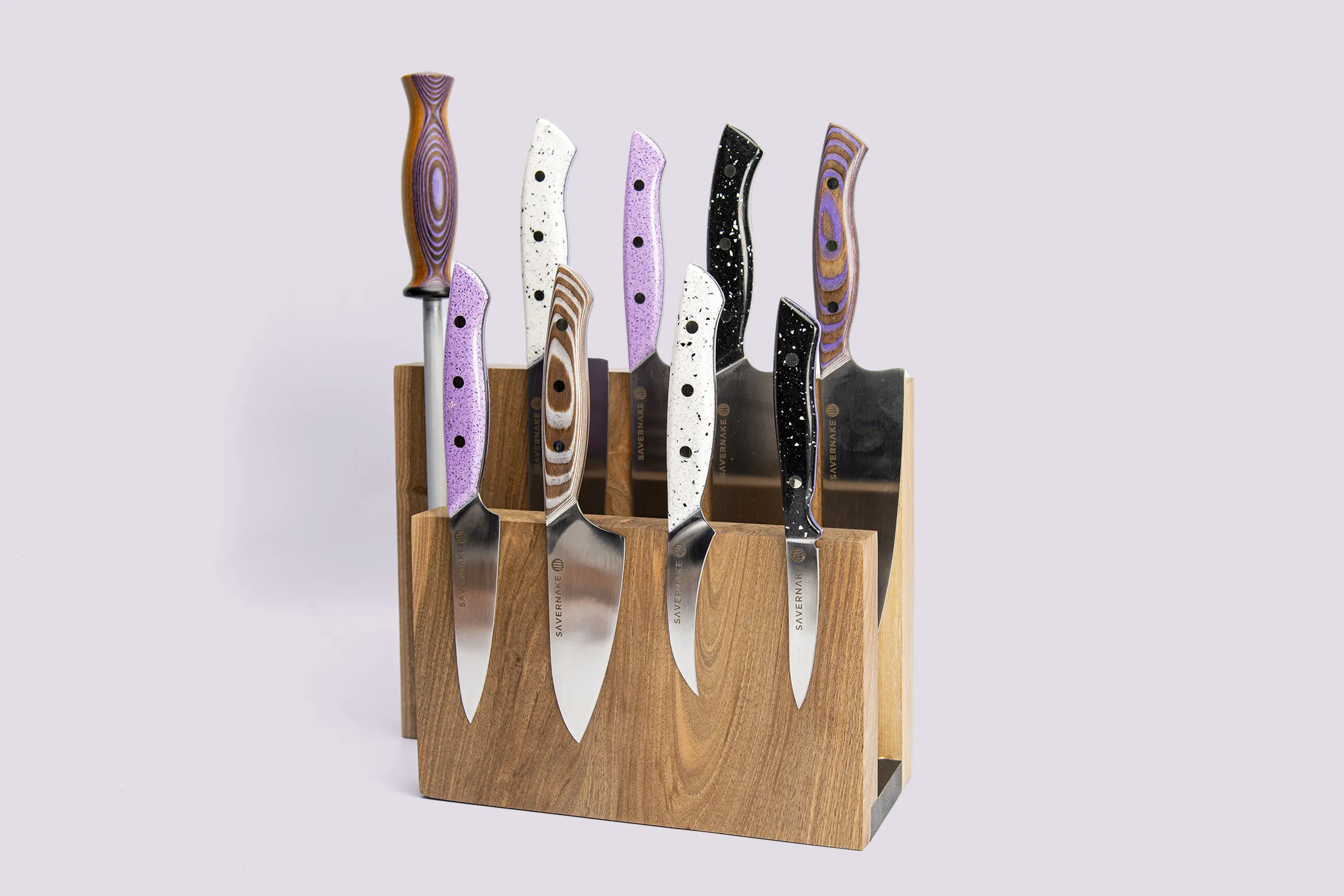 Jasmine Hemsley knife collection in lavender, white and grey Durat with a walnut rack