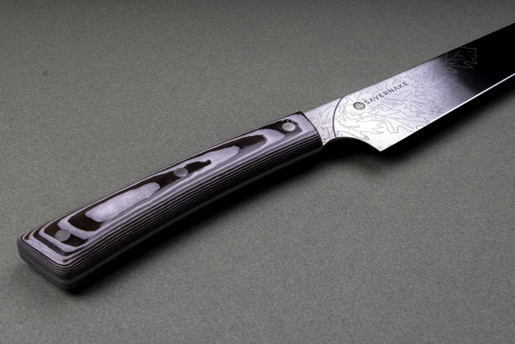 Elaborate engraving running the length of the salmon slicer