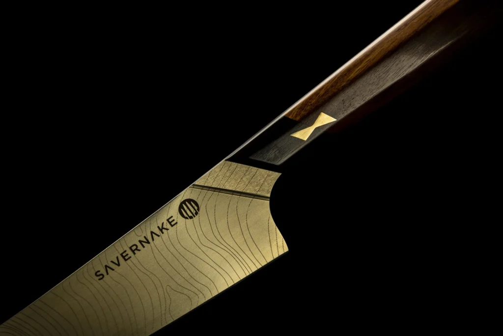 Set of four gold-finished knives made with Lanserring bespoke kitchens