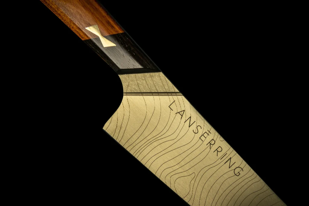 Lanserring knives finished in champagne gold with African blackwood handles