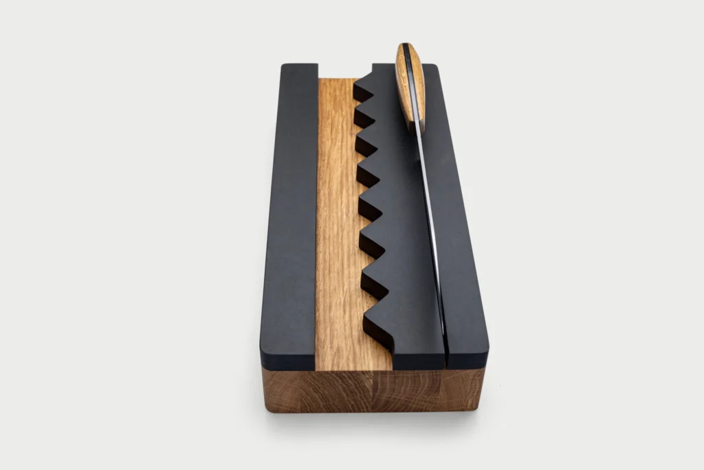 Monolith knife shown with its hand-finished oak handle